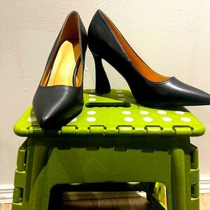 Women’s black heels, size 9.